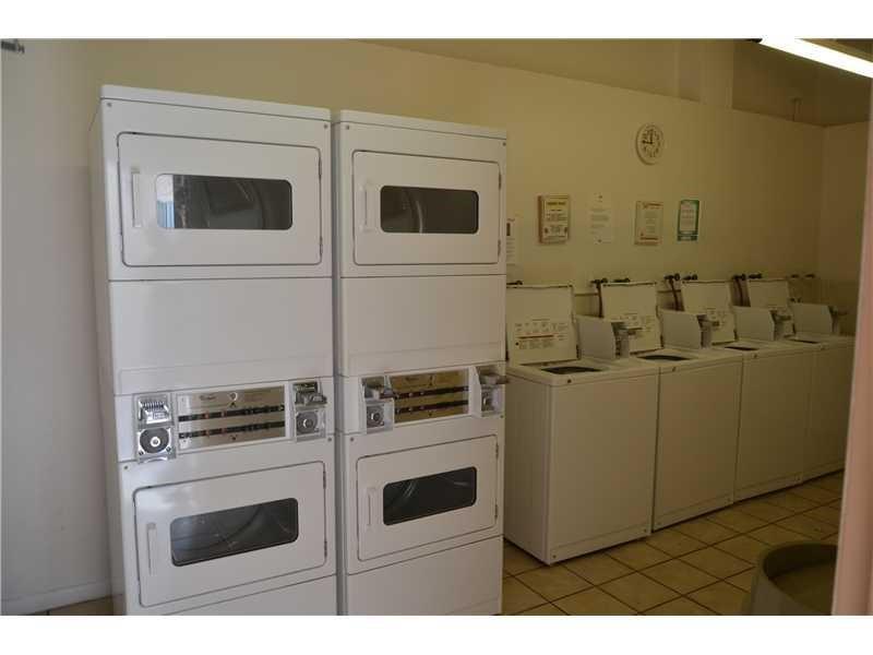 1481 South Ocean Boulevard, Unit 332C Pompano Beach, FL 33062 - Photo 12 of 24 a kitchen with a stove and a microwave