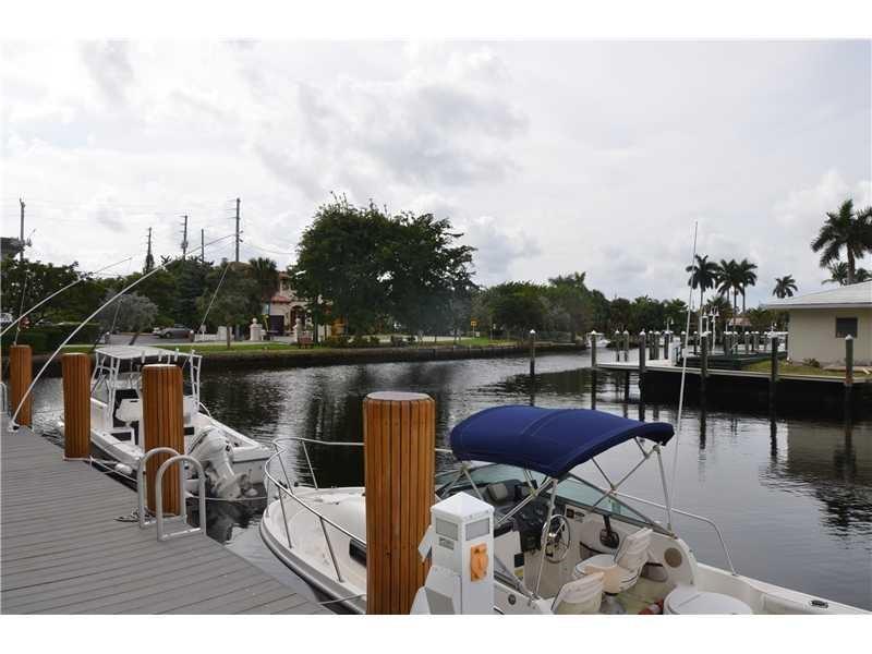1481 South Ocean Boulevard, Unit 332C Pompano Beach, FL 33062 - Photo 13 of 24 a balcony with couple of chairs and wooden floor