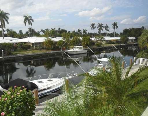 1481 South Ocean Boulevard, Unit 332C Pompano Beach, FL 33062 - Photo 20 of 24 a view of a lake with a house