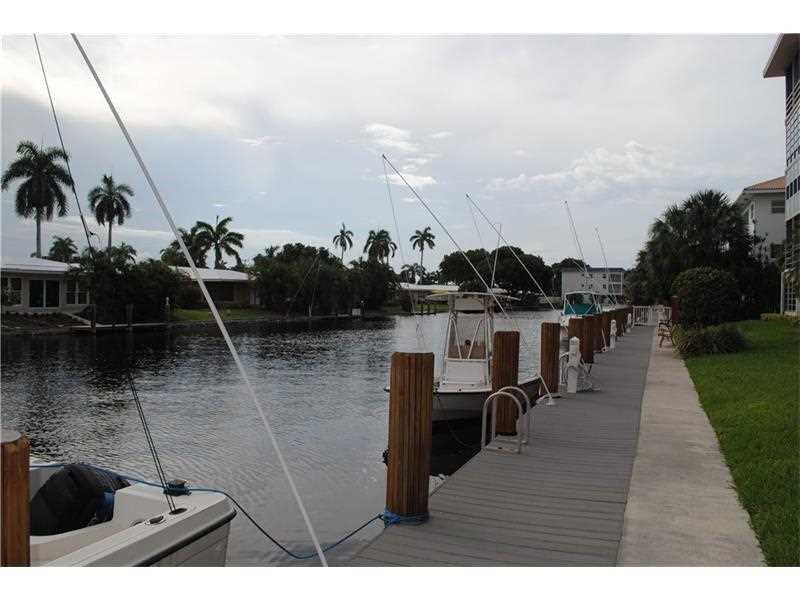 1481 South Ocean Boulevard, Unit 332C Pompano Beach, FL 33062 - Photo 2 of 24 a terrace with outdoor seating and kitchen view