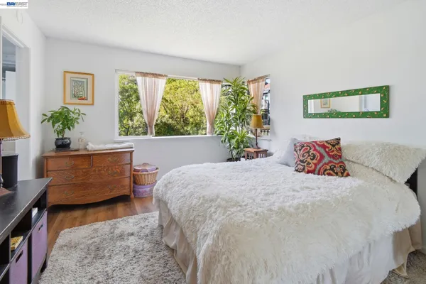 a bedroom with a bed and a couch
