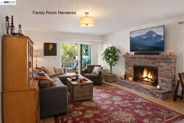 a living room with furniture a flat screen tv and a fireplace