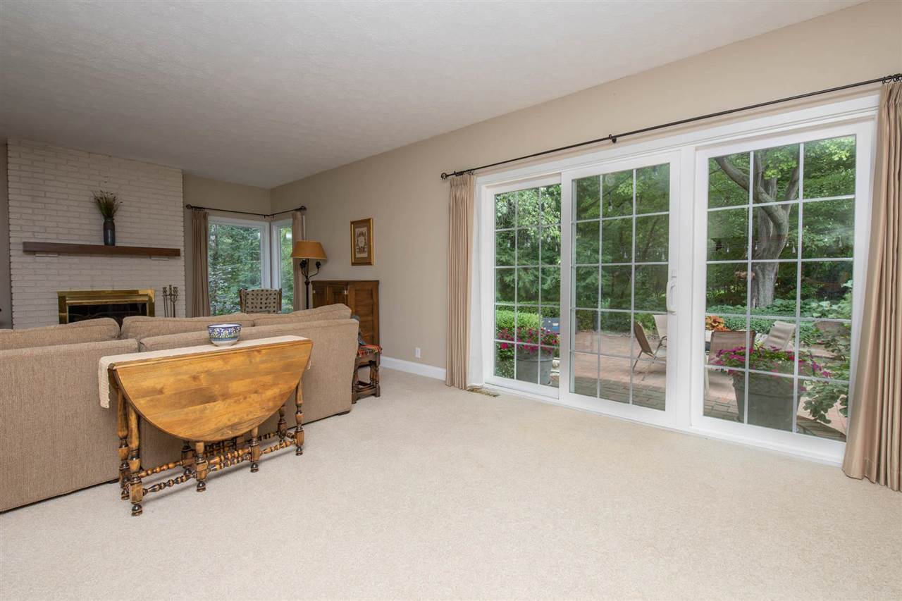 4716 Spring Creek Road Rockford, IL 61114 - Photo 12 of 50 a living room with furniture and a fireplace