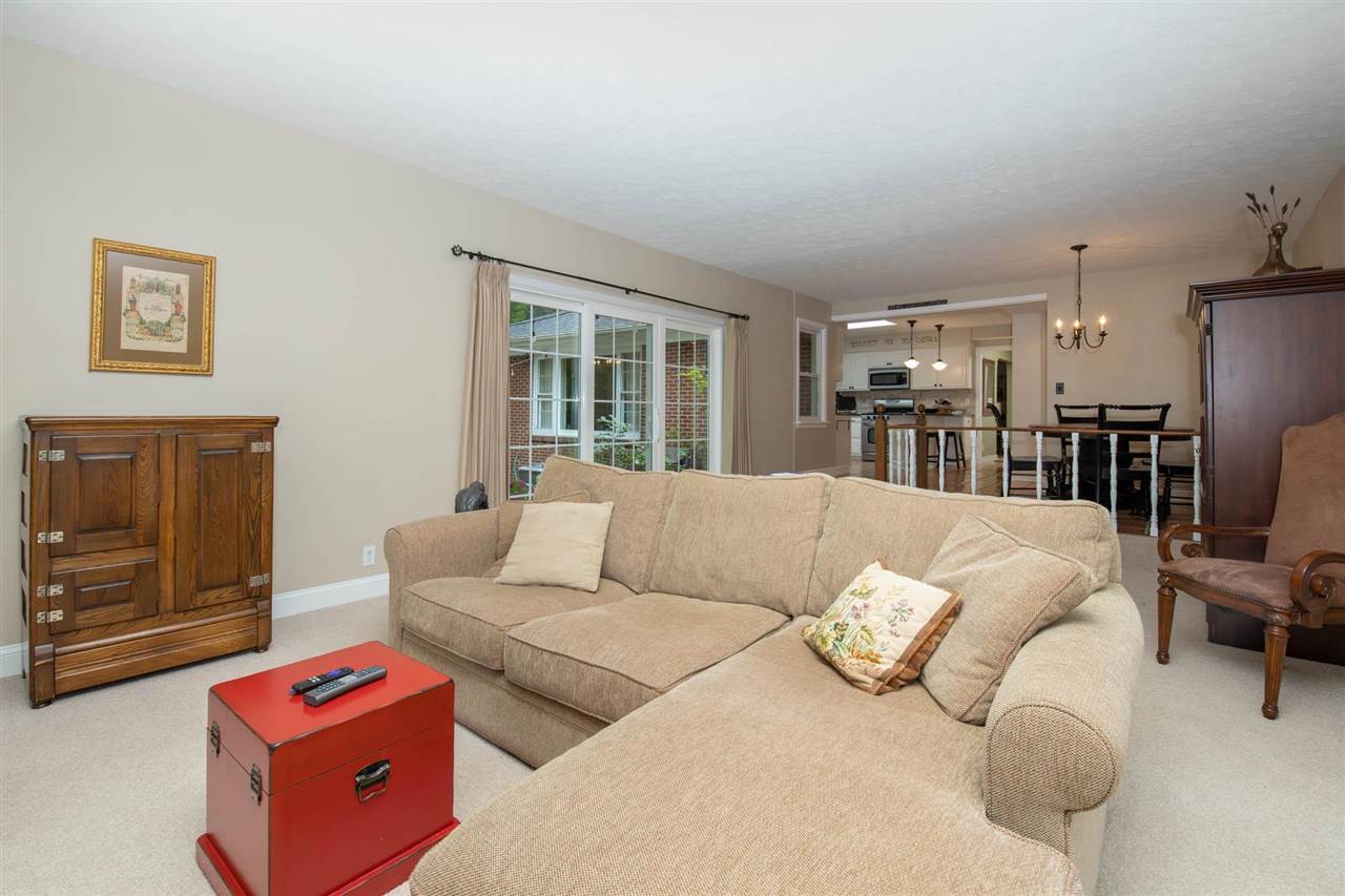 4716 Spring Creek Road Rockford, IL 61114 - Photo 14 of 50 a living room with furniture and a flat screen tv