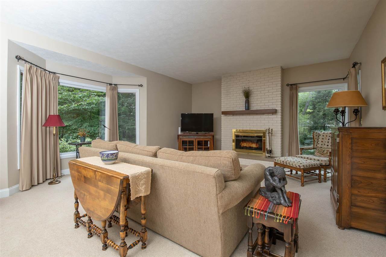 4716 Spring Creek Road Rockford, IL 61114 - Photo 15 of 50 a living room with furniture and a fireplace