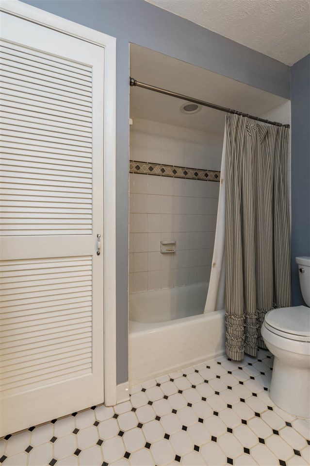 4716 Spring Creek Road Rockford, IL 61114 - Photo 20 of 50 a bathroom with a shower and a toilet