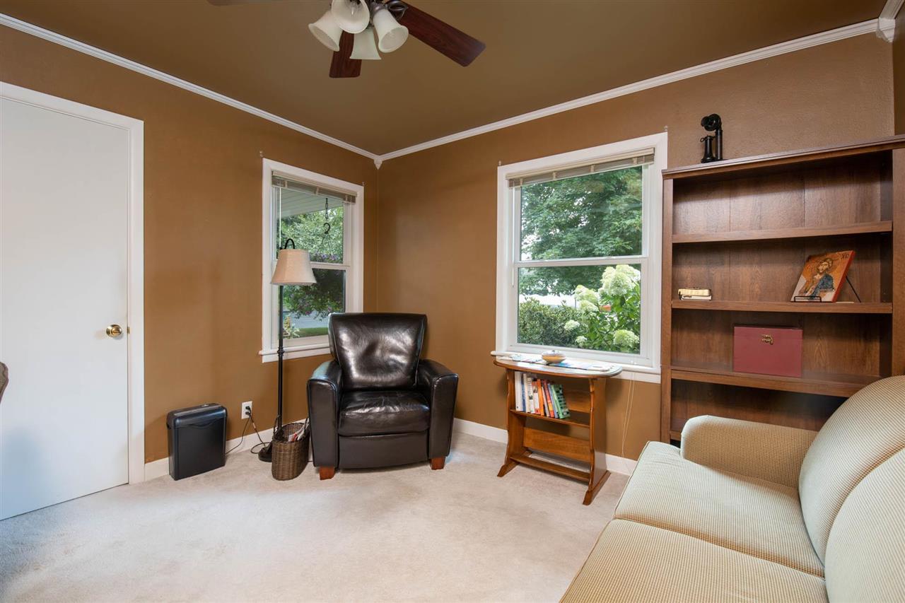 4716 Spring Creek Road Rockford, IL 61114 - Photo 22 of 50 a living room with furniture and a window