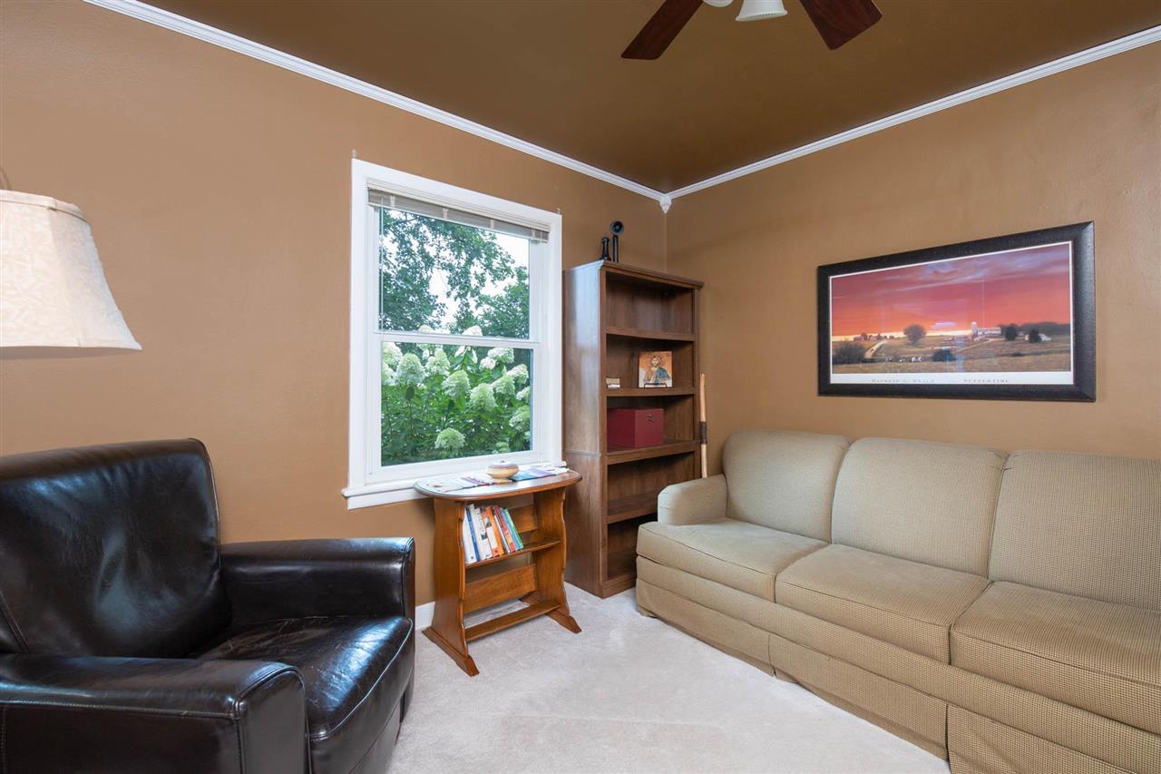 4716 Spring Creek Road Rockford, IL 61114 - Photo 23 of 50 a living room with furniture and a window