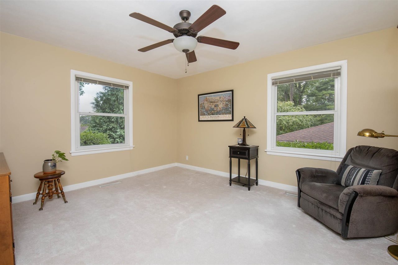 4716 Spring Creek Road Rockford, IL 61114 - Photo 24 of 50 a living room with furniture and a window