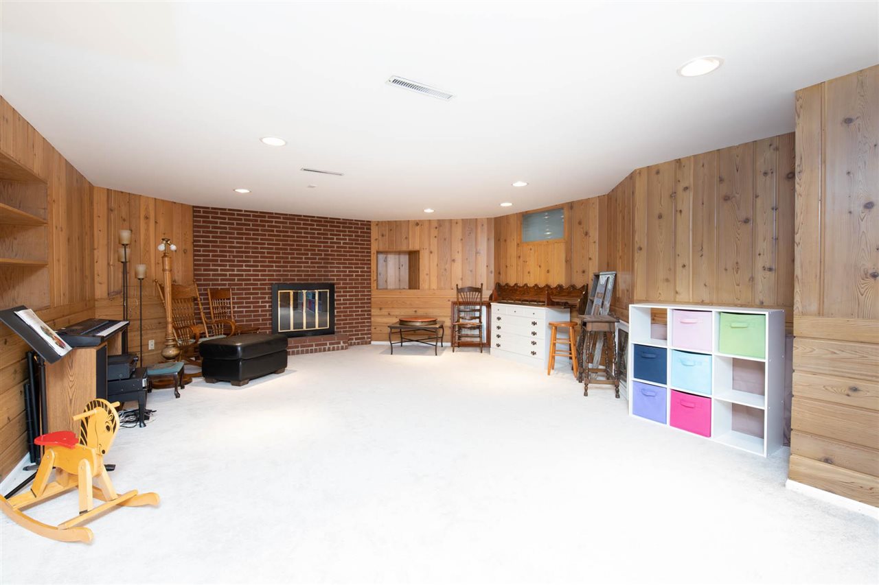 4716 Spring Creek Road Rockford, IL 61114 - Photo 29 of 50 a room with furniture and a flat screen tv