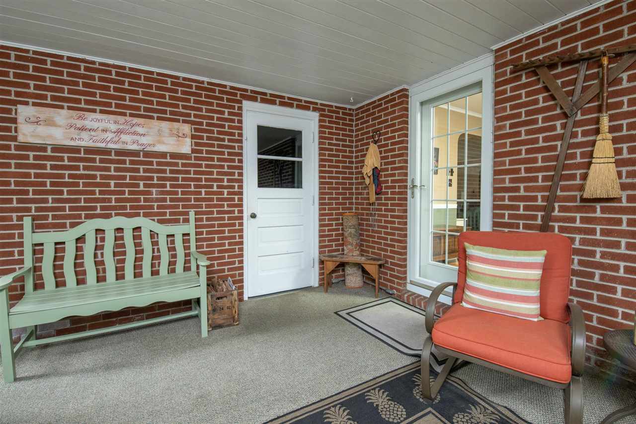 4716 Spring Creek Road Rockford, IL 61114 - Photo 37 of 50 a balcony with a bench next to a window