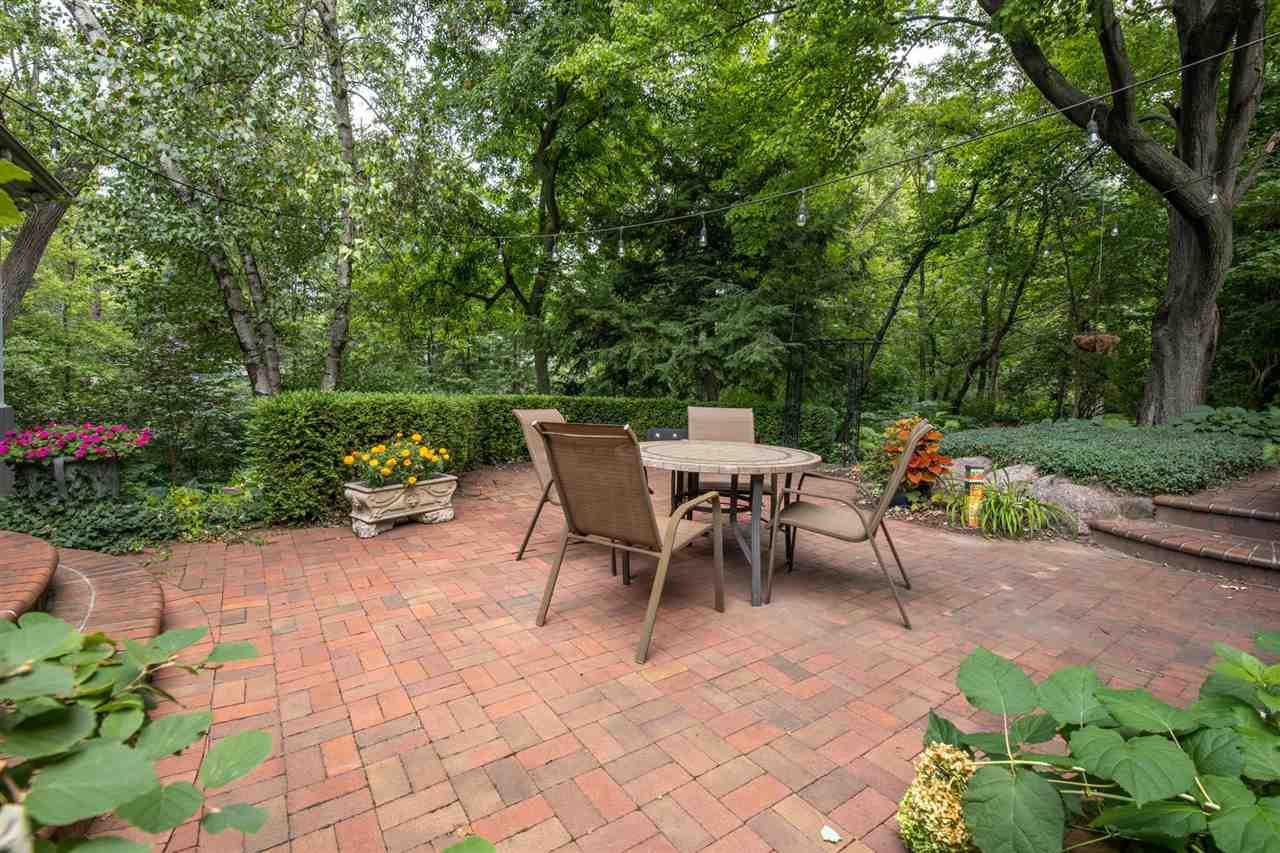 4716 Spring Creek Road Rockford, IL 61114 - Photo 38 of 50 a view of a tables and chairs in back yard of the house
