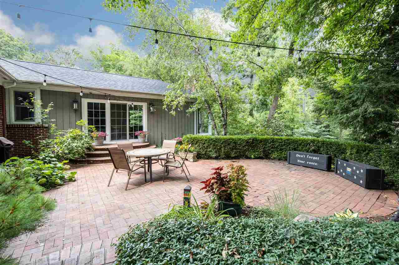 4716 Spring Creek Road Rockford, IL 61114 - Photo 39 of 50 a view of a patio with table and chairs potted plants