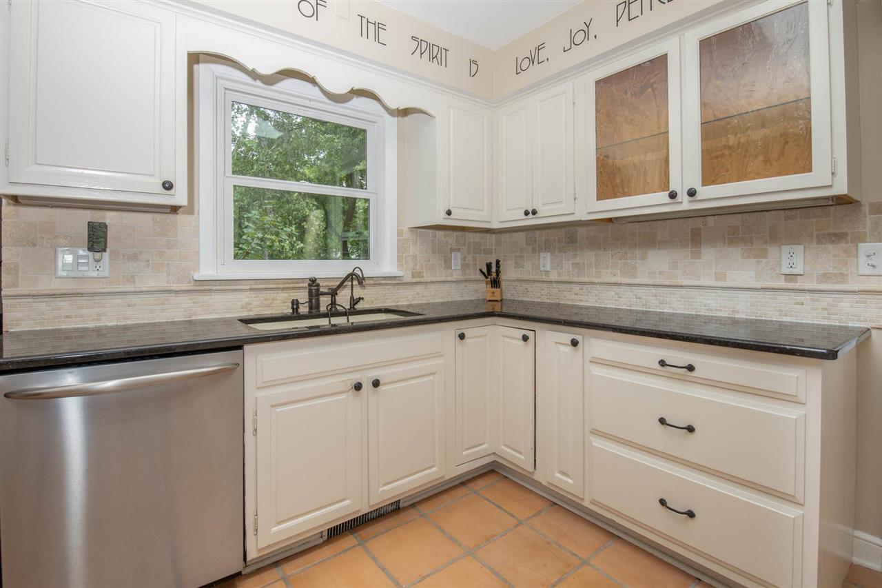 4716 Spring Creek Road Rockford, IL 61114 - Photo 9 of 50 a kitchen with appliances cabinets and a window
