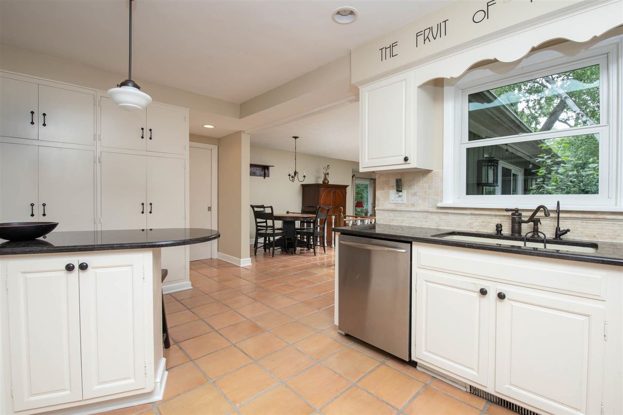 4716 Spring Creek Road Rockford, IL 61114 - Photo 10 of 50 a kitchen with stainless steel appliances granite countertop a sink and cabinets