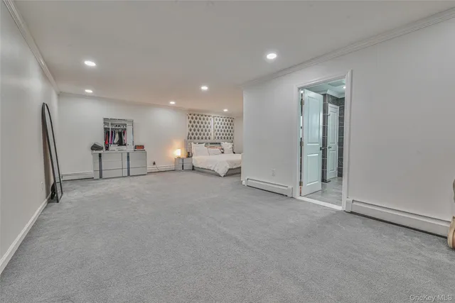 a bedroom with a bed and a couch