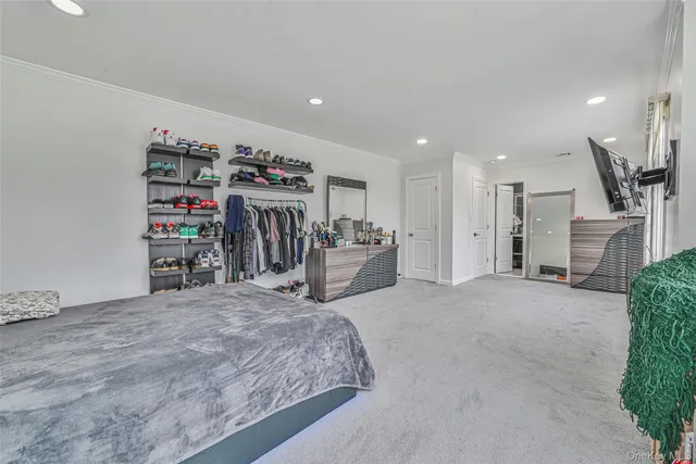 a view of a livingroom with furniture and a flat screen tv