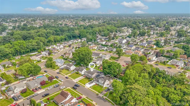 an aerial view of residential building with green space