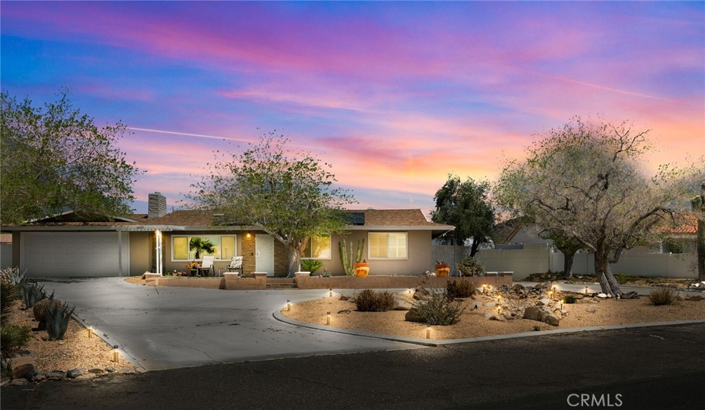 16420 Rimrock Road Apple Valley, CA 92307 - Photo 1 of 1 a view of a house with backyard and sitting area