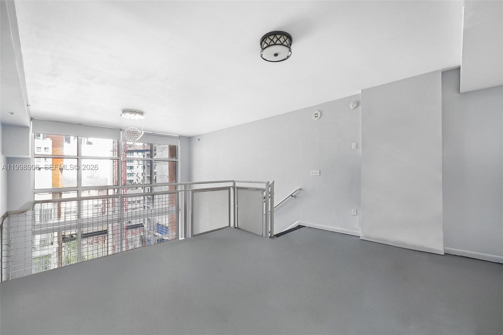 244 Biscayne Boulevard, Unit 445 Miami, FL 33132 - Photo 19 of 35 a view of an empty room with a window