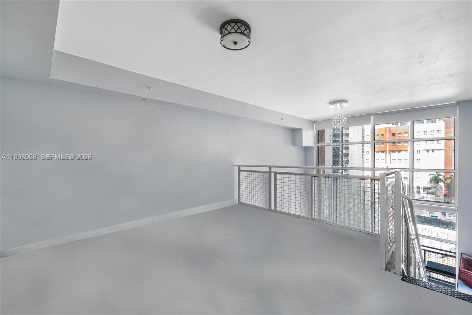 244 Biscayne Boulevard, Unit 445 Miami, FL 33132 - Photo 22 of 35 a view of empty room with wooden floor