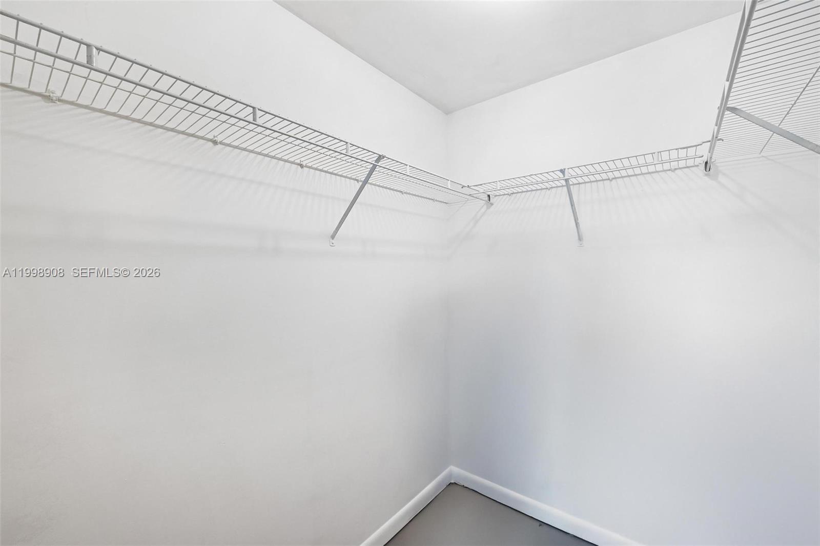 244 Biscayne Boulevard, Unit 445 Miami, FL 33132 - Photo 23 of 35 a view of a room with racks on the wall