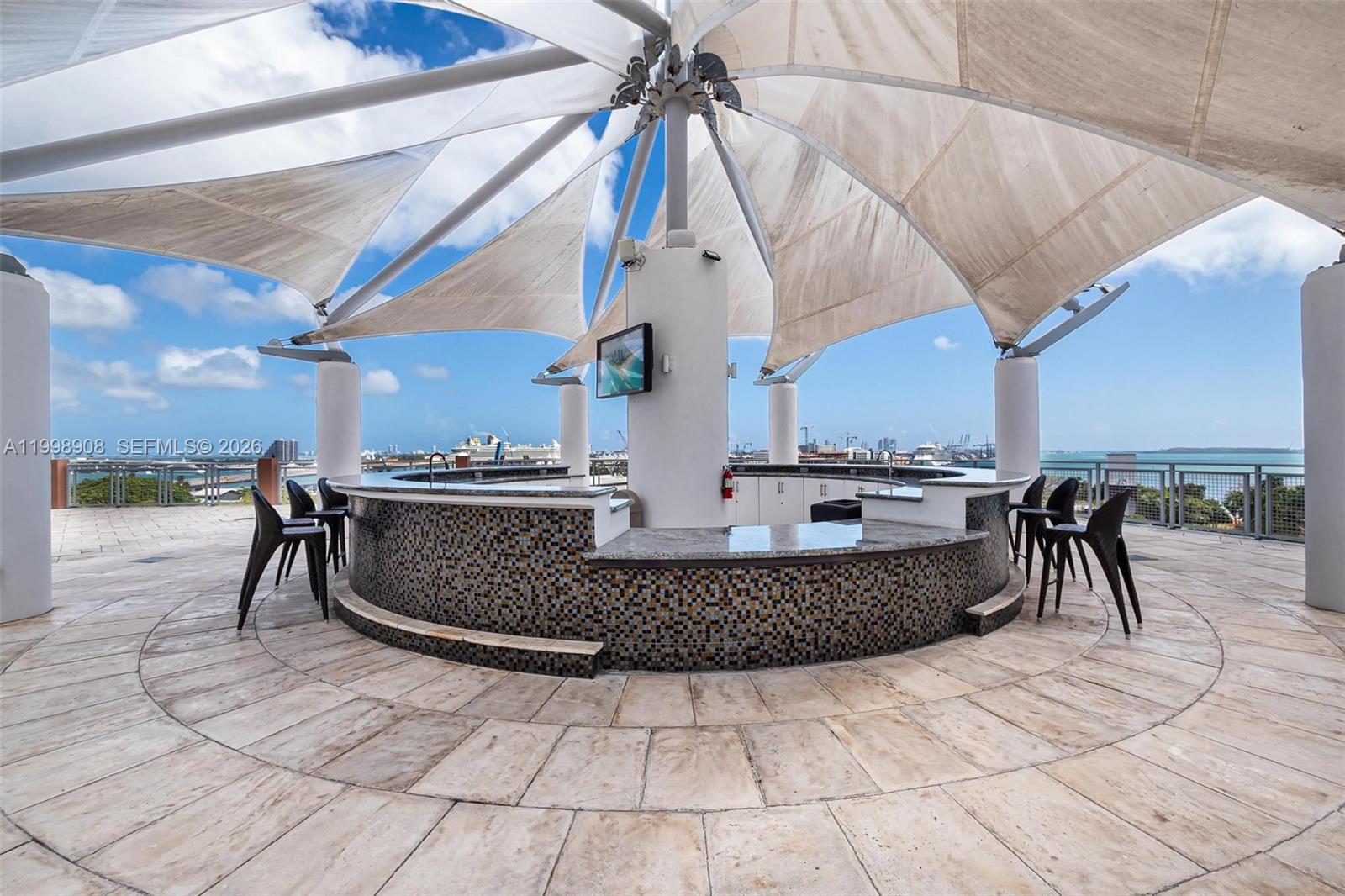 244 Biscayne Boulevard, Unit 445 Miami, FL 33132 - Photo 24 of 35 a view of a swimming pool with a chairs