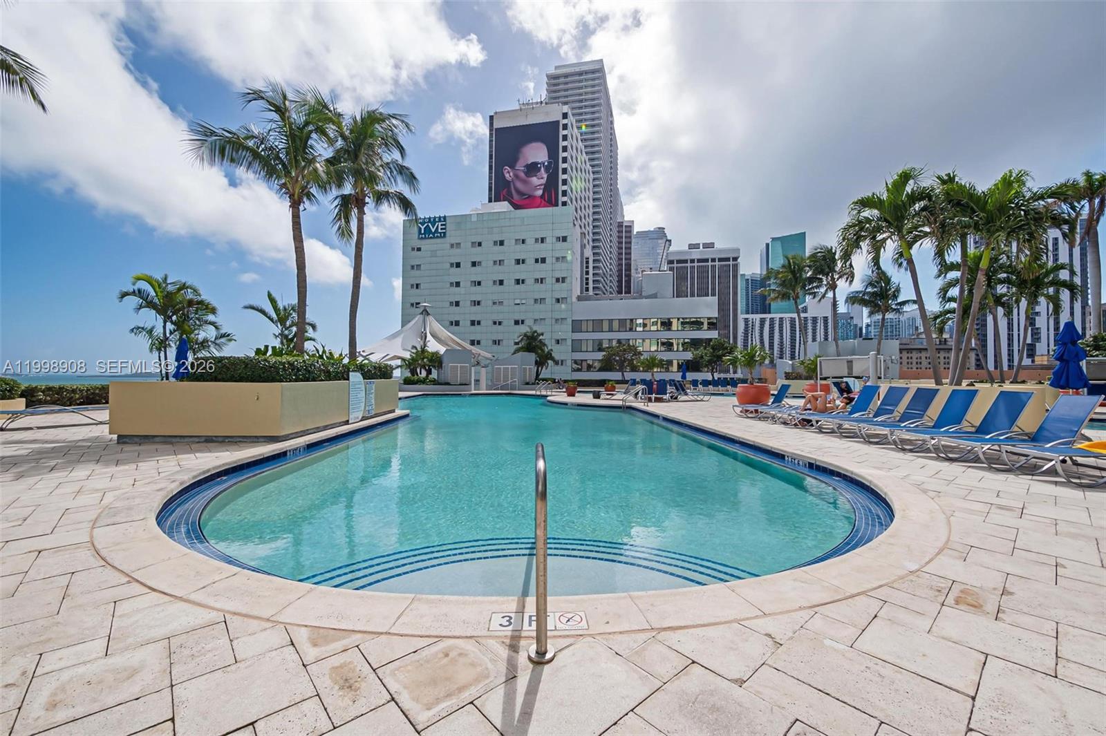 244 Biscayne Boulevard, Unit 445 Miami, FL 33132 - Photo 27 of 35 a view of a swimming pool with a terrace