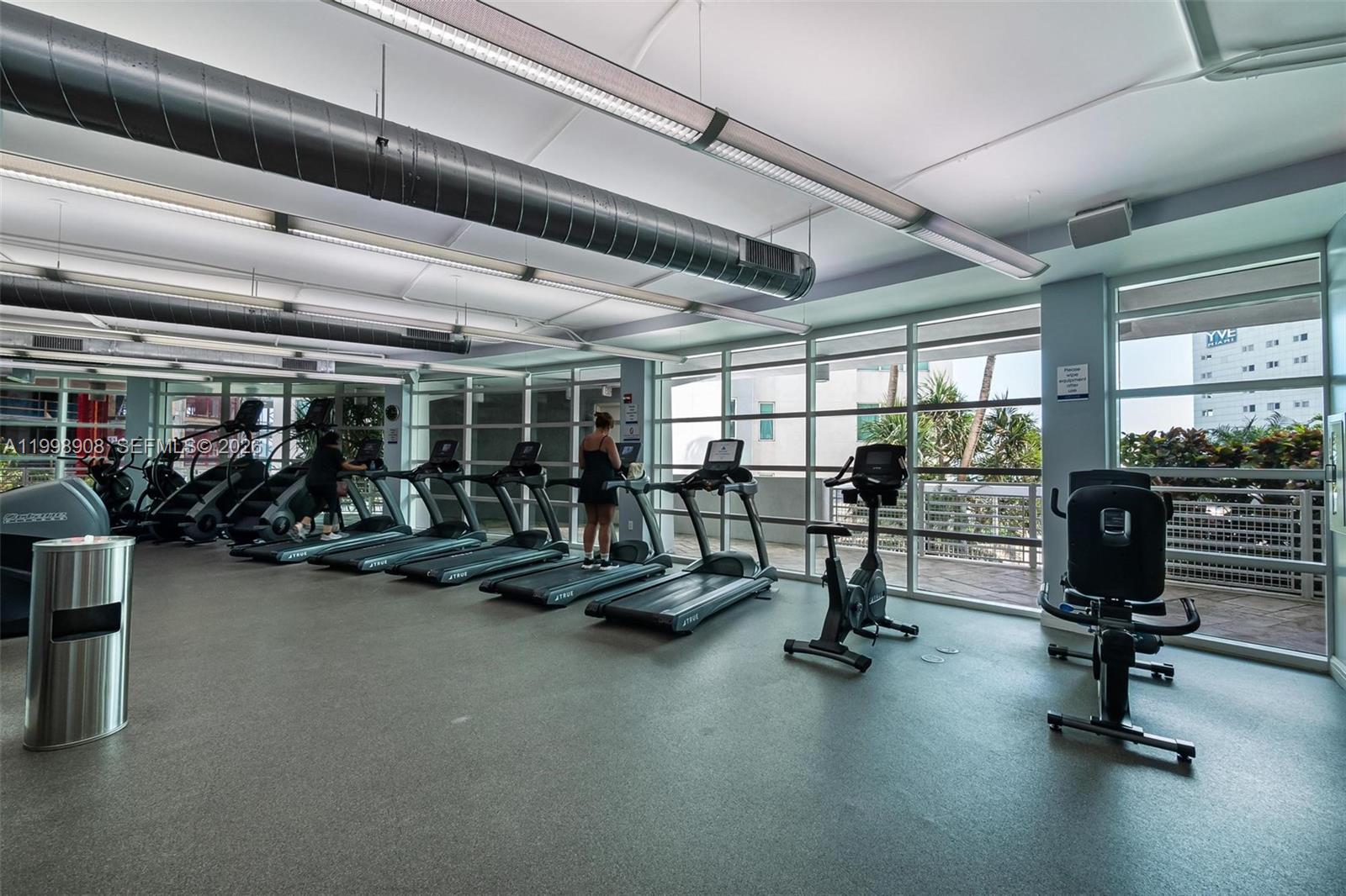 244 Biscayne Boulevard, Unit 445 Miami, FL 33132 - Photo 30 of 35 a view of a room with gym equipment