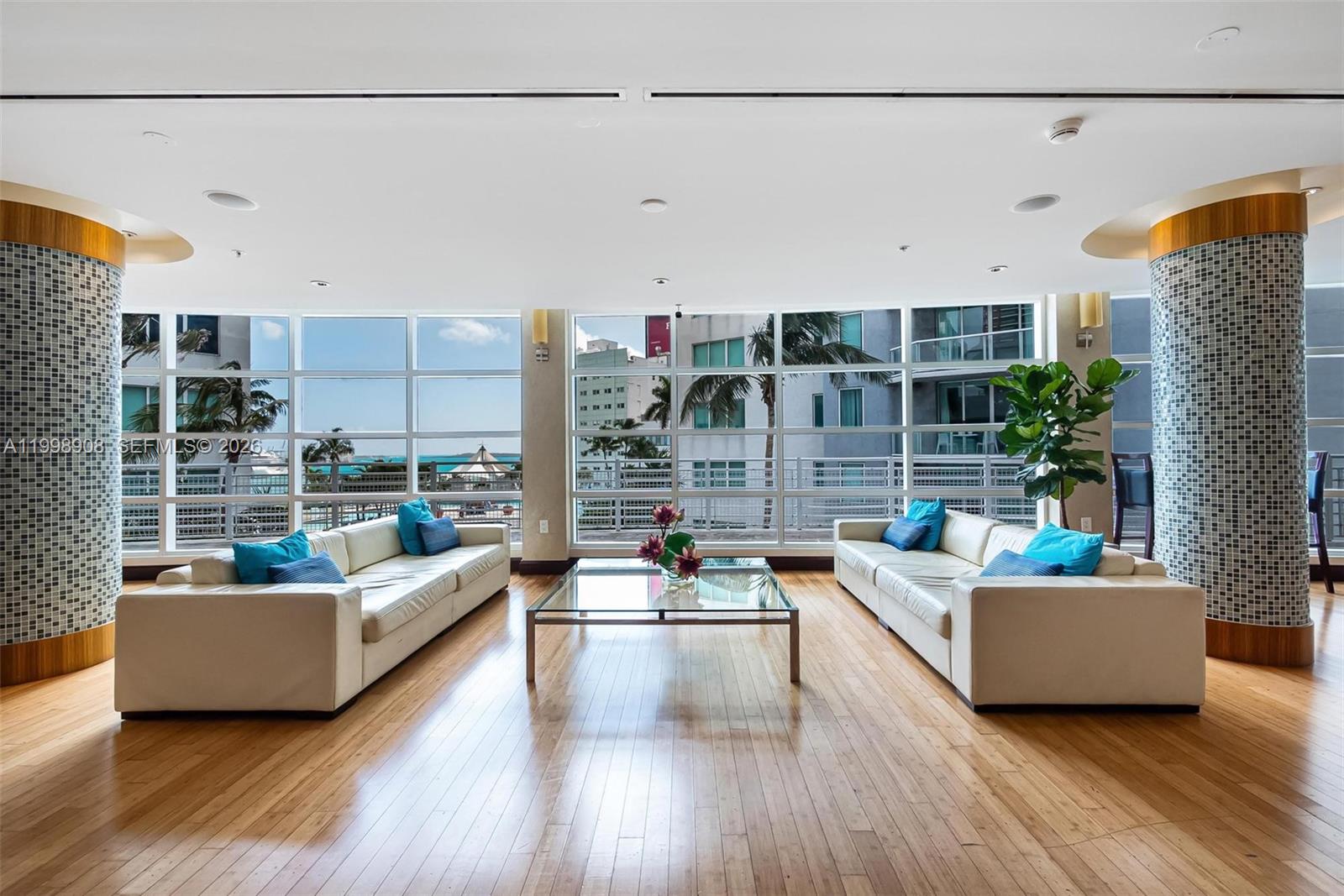 244 Biscayne Boulevard, Unit 445 Miami, FL 33132 - Photo 33 of 35 a living room with furniture and a large window