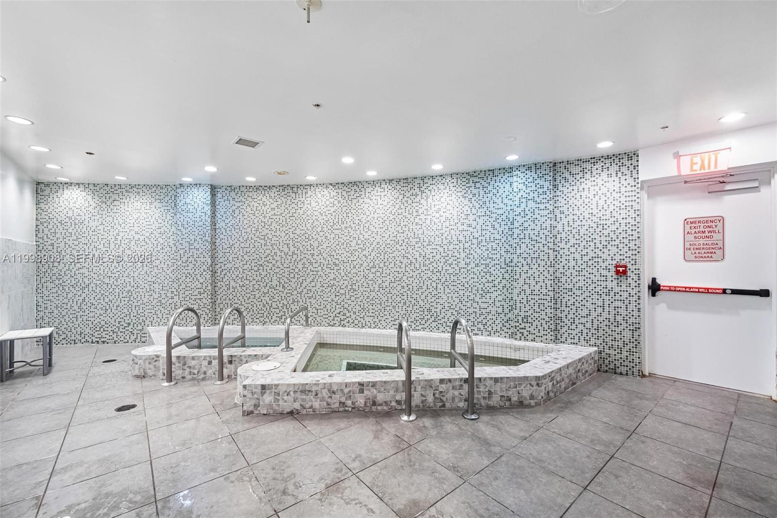 244 Biscayne Boulevard, Unit 445 Miami, FL 33132 - Photo 35 of 35 a view of a room with table and chairs