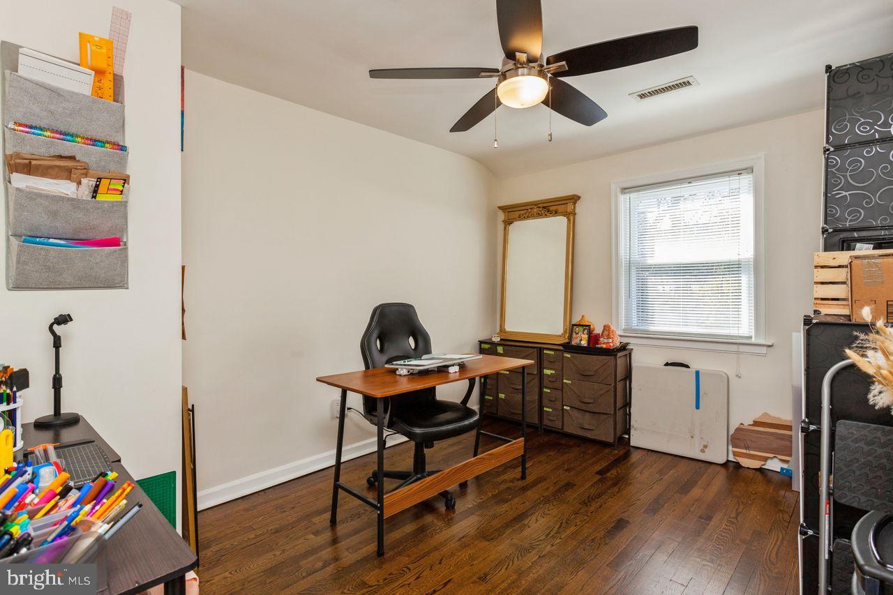 3920 Rexmere Road Baltimore, MD 21218 - Photo 18 of 35 a view of a workspace with furniture and a window