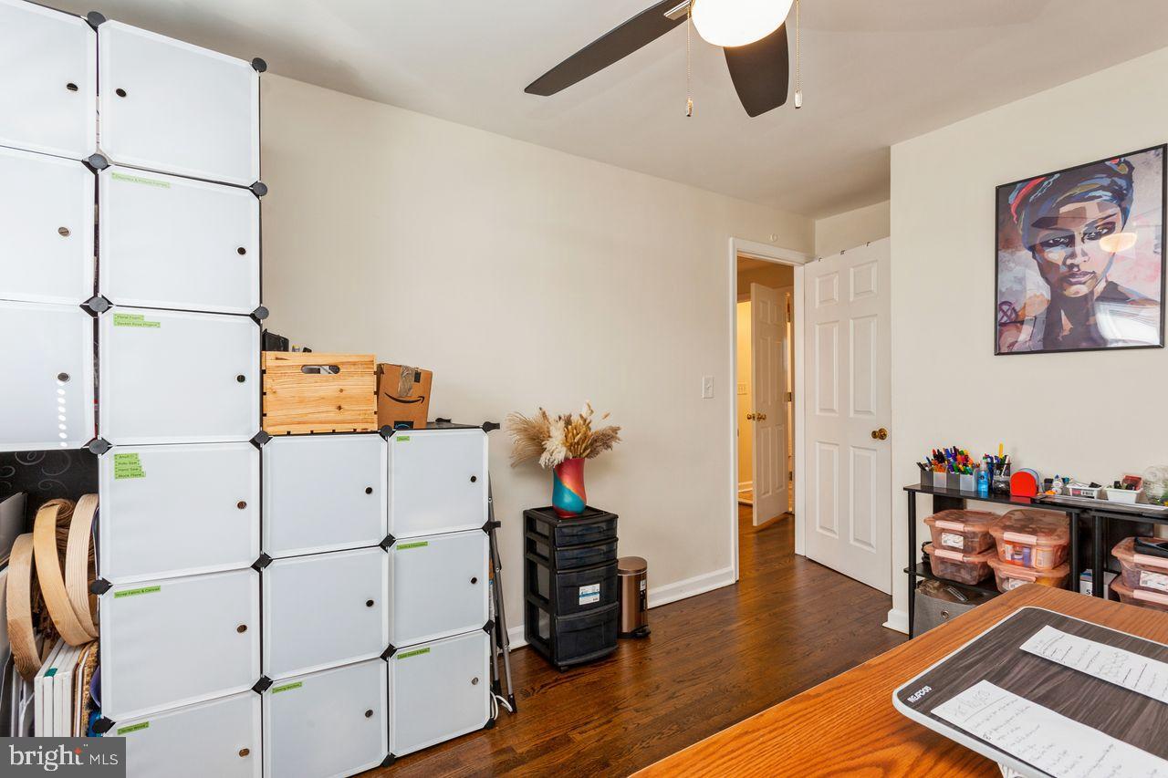 3920 Rexmere Road Baltimore, MD 21218 - Photo 19 of 35 a living room with furniture and a wooden floor