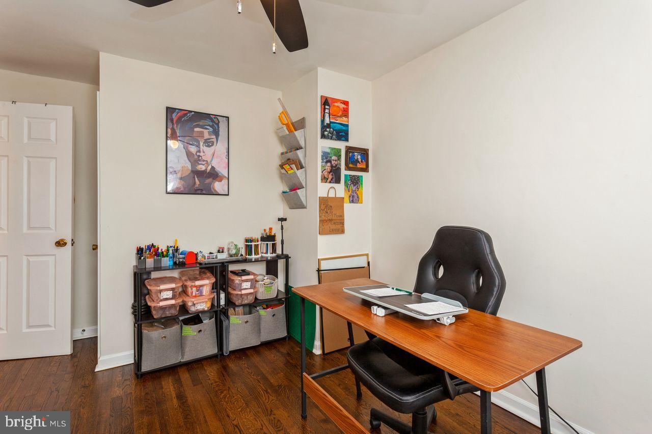 3920 Rexmere Road Baltimore, MD 21218 - Photo 20 of 35 a workspace with furniture and wooden floor