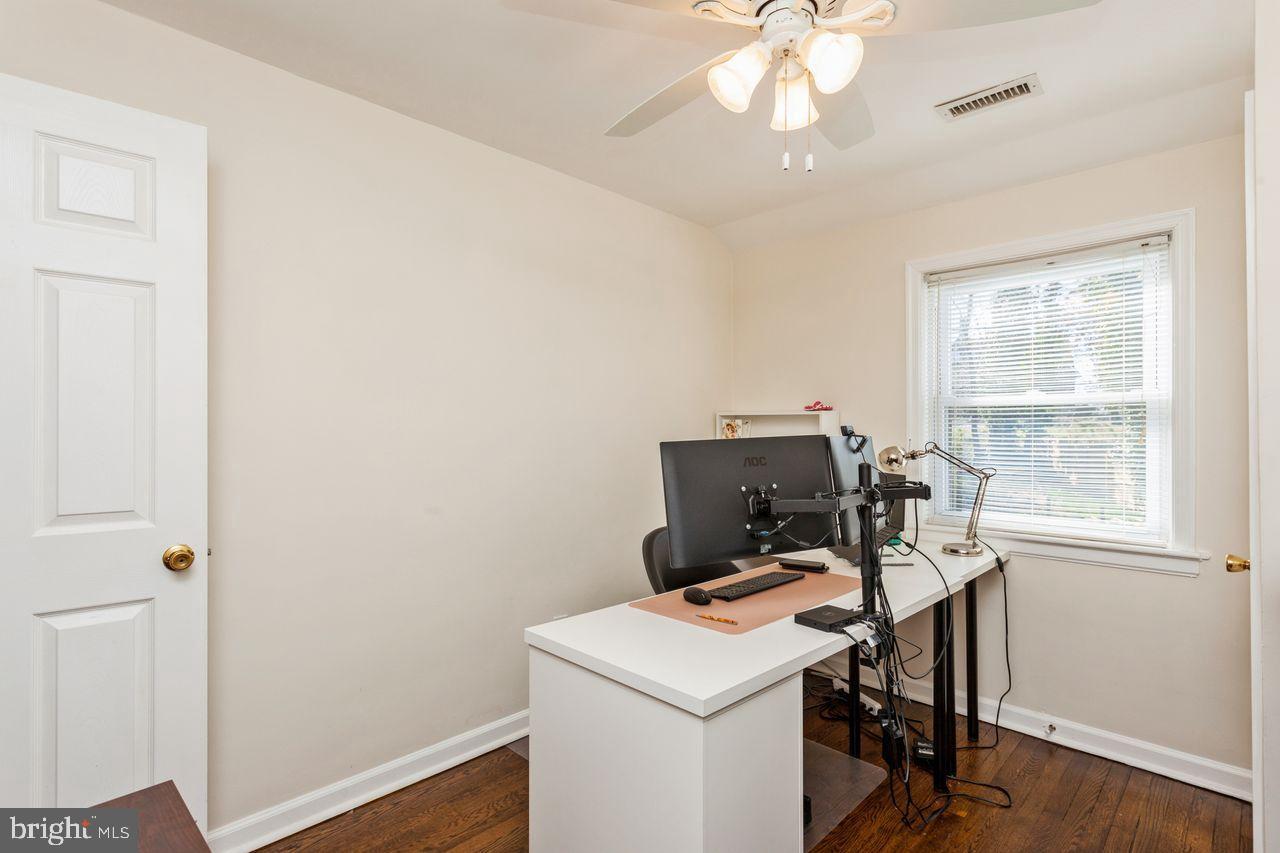 3920 Rexmere Road Baltimore, MD 21218 - Photo 22 of 35 a view of workspace with wooden floor windows