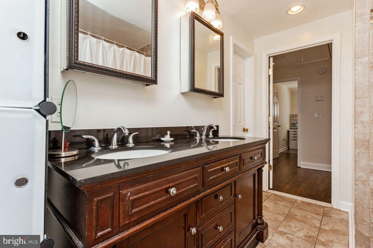 3920 Rexmere Road Baltimore, MD 21218 - Photo 25 of 35 a kitchen with a sink and cabinets