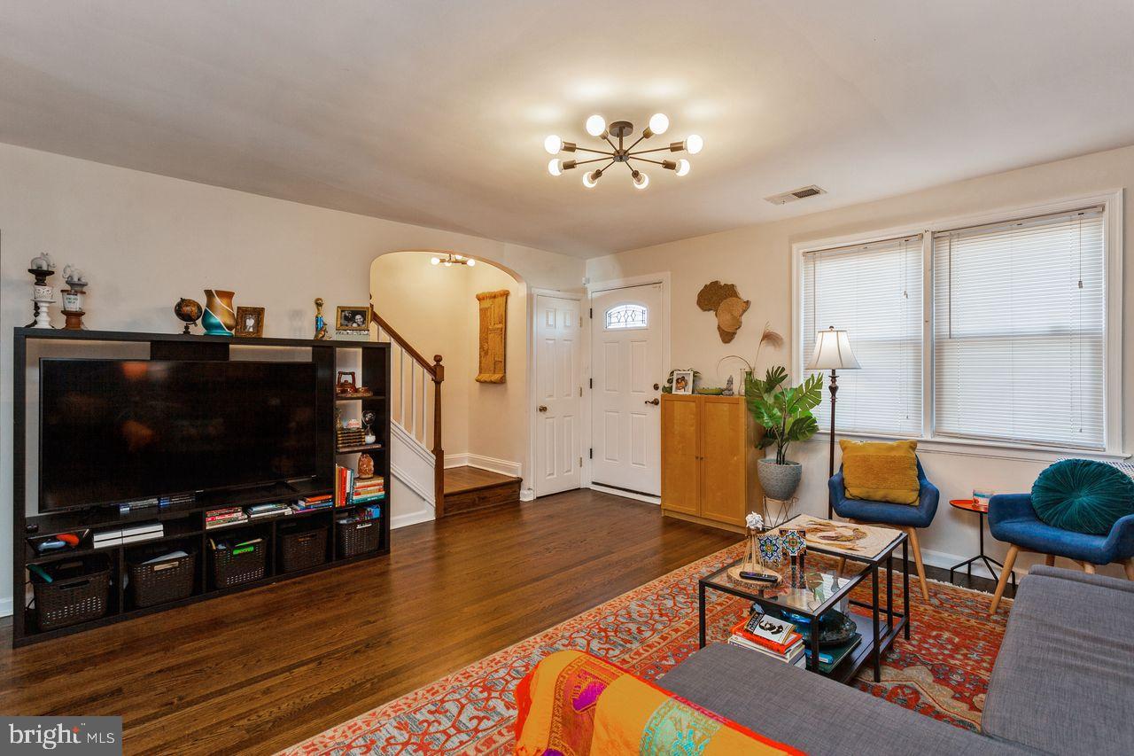 3920 Rexmere Road Baltimore, MD 21218 - Photo 8 of 35 a living room with furniture and a flat screen tv