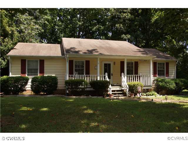 12112 Quito Road Midlothian, VA 23112 - Photo 1 of 7 a front view of a house with a yard