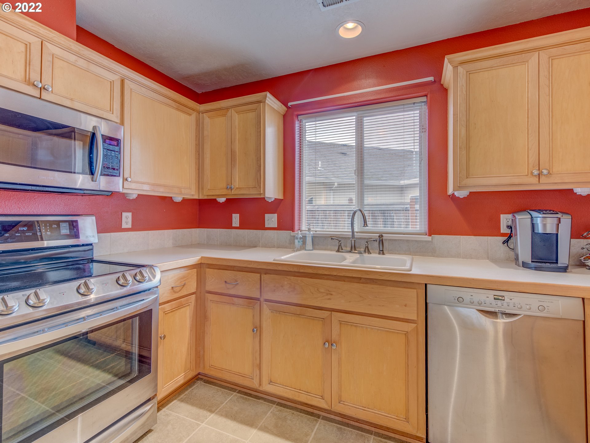 695 62nd Street Springfield, OR 97478 - Photo 11 of 30 a kitchen with stainless steel appliances granite countertop a sink and a stove