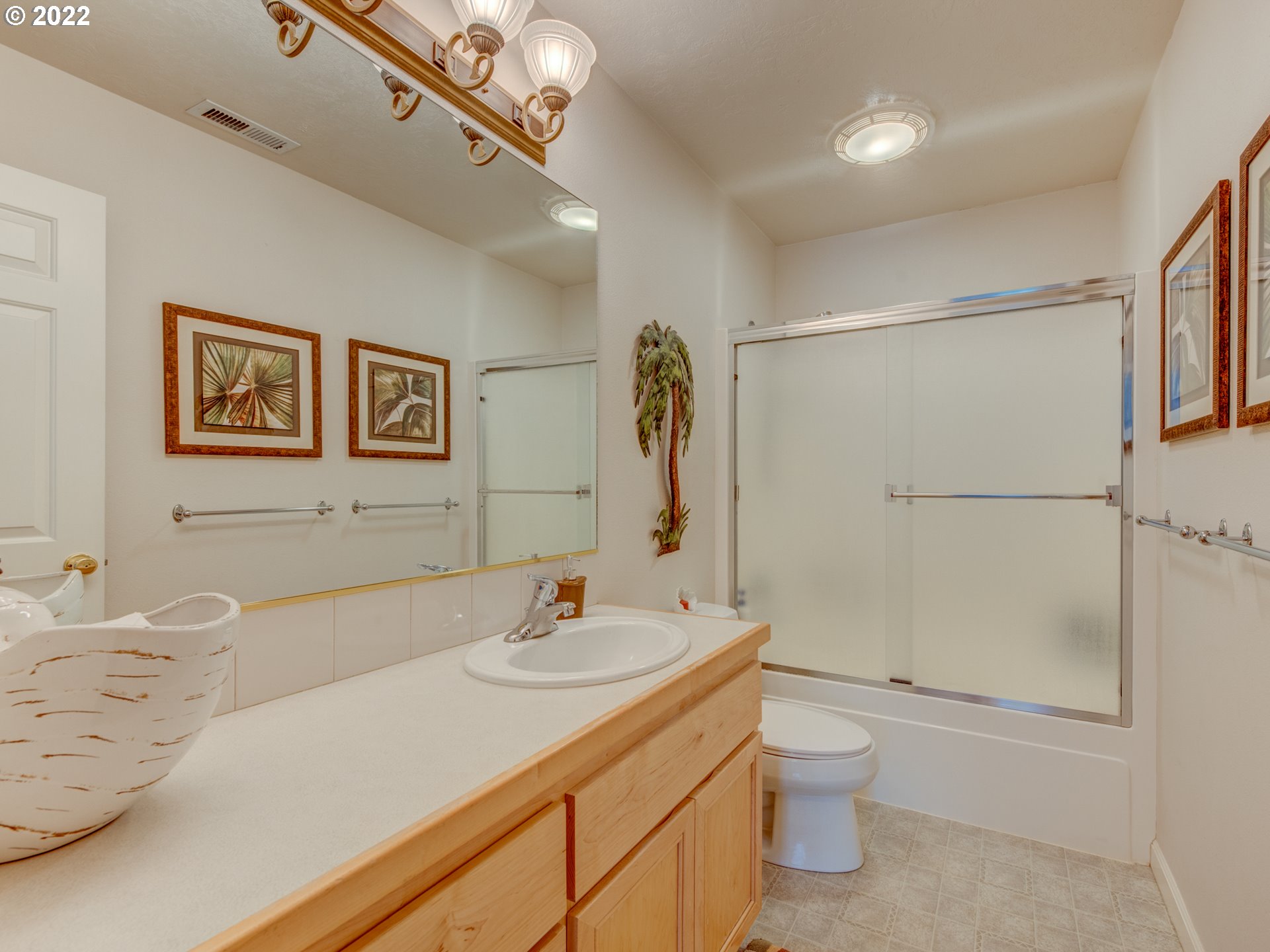 695 62nd Street Springfield, OR 97478 - Photo 21 of 30 a bathroom with a sink a toilet and shower