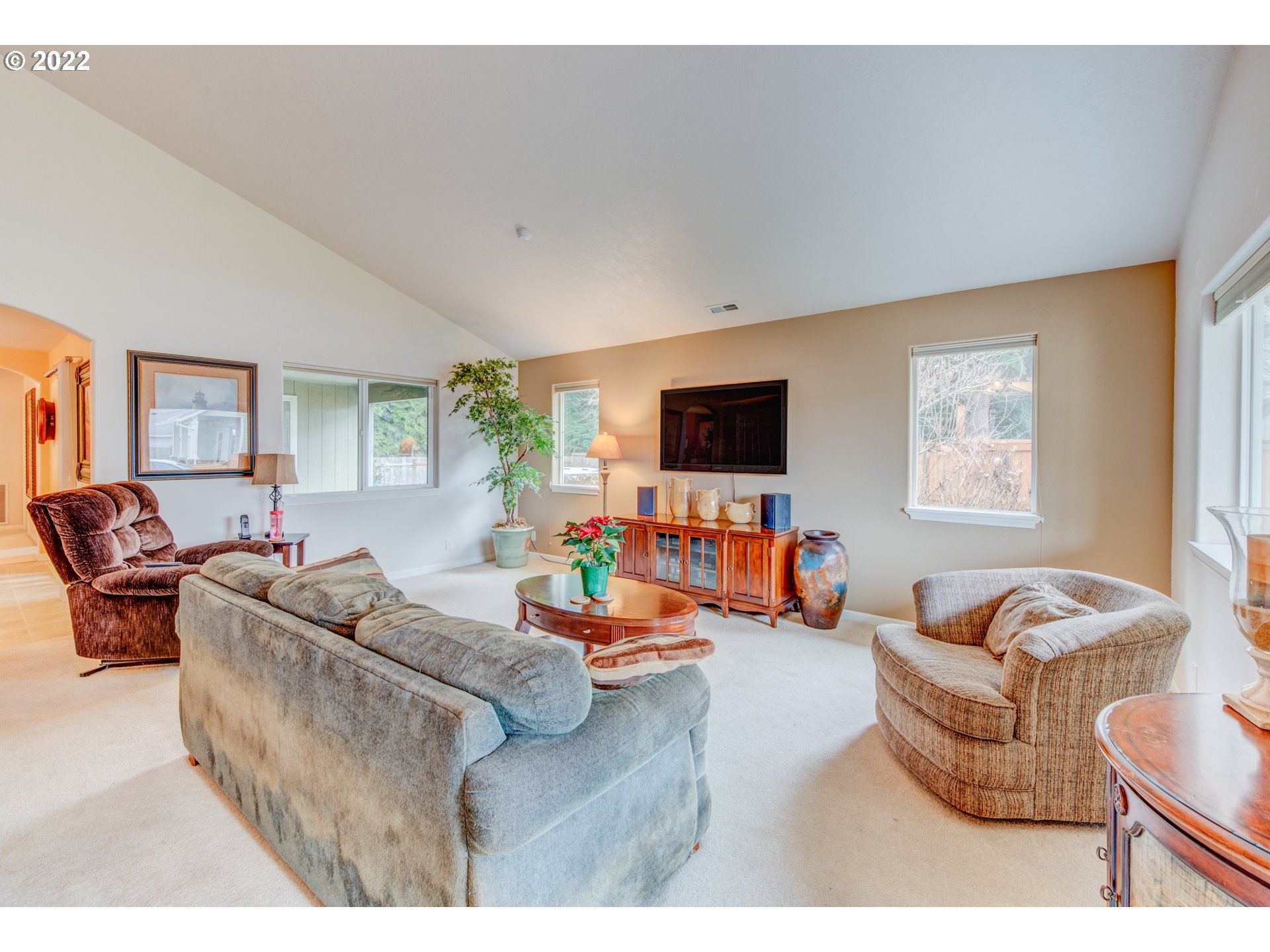 695 62nd Street Springfield, OR 97478 - Photo 6 of 30 a living room with furniture and a flat screen tv