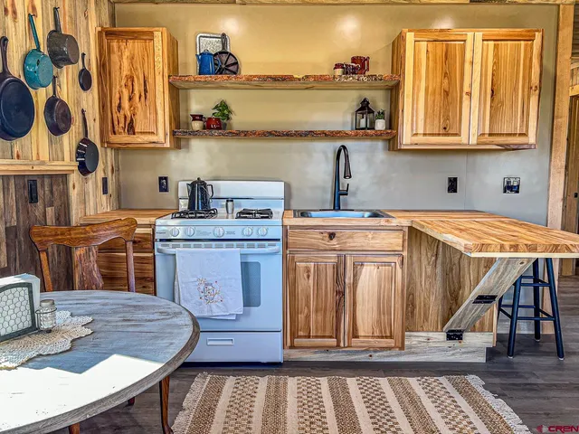 a view of a dining room with furniture and window