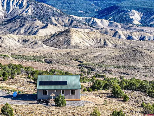 a view of a yard with a mountain