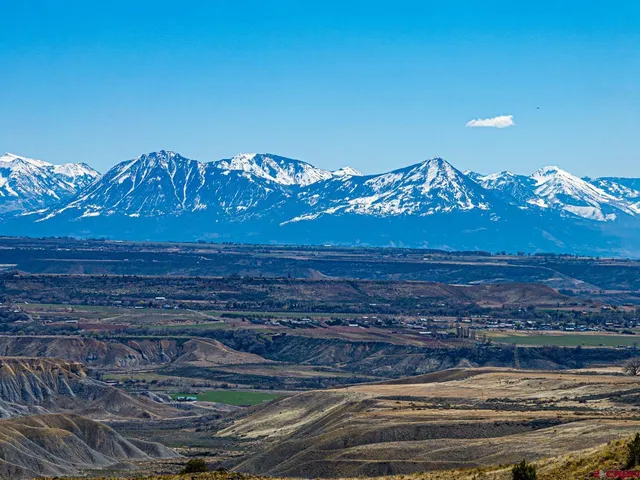 a view of a city with mountains in the background
