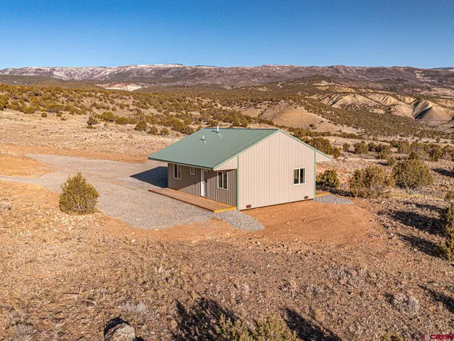 an aerial view of houses with a outdoor space