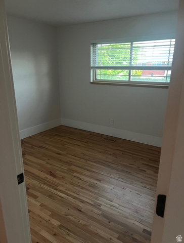 541 Mingo View Avenue Sandy, UT 84070 - Photo 8 of 16 Wood-finish flooring throughout, complemented by white baseboards and neutral wall tones