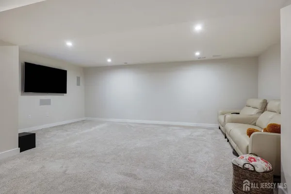 a room with furniture and a flat screen tv