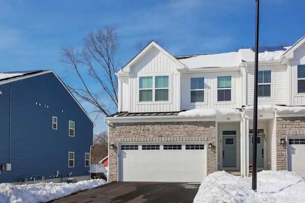 a living room with a bed and furniture