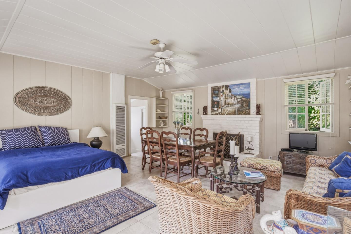 25286 Hatton Road Carmel, CA 93923 - Photo 30 of 34 a living room with furniture a chandelier and a window
