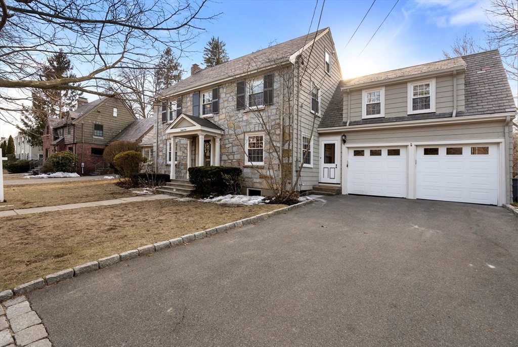 21 Sheldon Road Newton, MA 02459 - Photo 1 of 34 a big house with a large tree in front of it